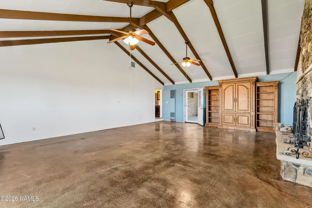 a view of walk in closet with empty room