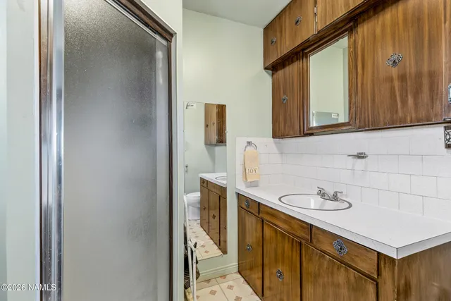 a front view of a house with a yard from a outdoor seating