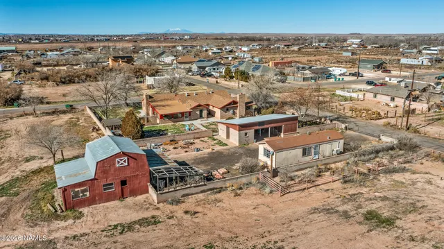 a view of a yard with cars