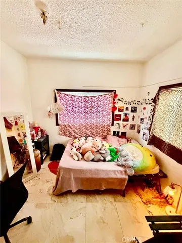 a bedroom with furniture and a couch