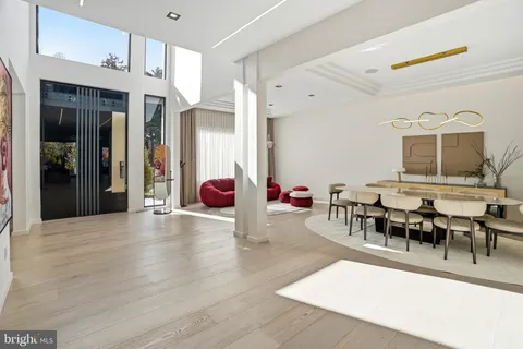 a view of a livingroom with furniture and a window