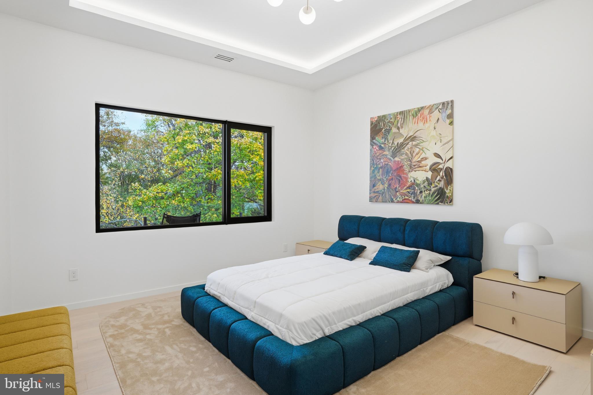 9408 Old Courthouse Road Vienna, VA 22182 - Photo 58 of 91 Serene bedroom with vibrant nature views.