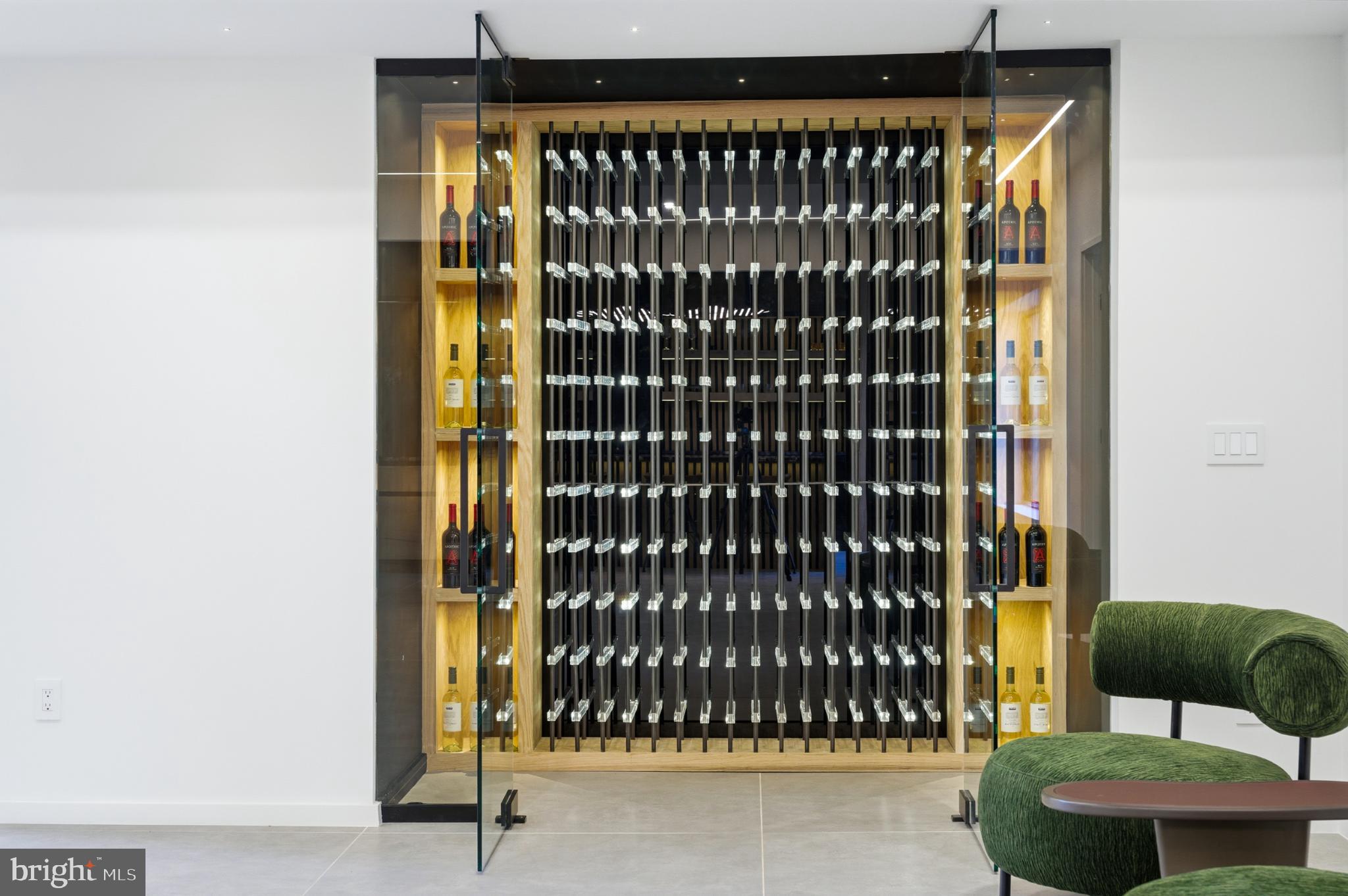 9408 Old Courthouse Road Vienna, VA 22182 - Photo 78 of 91 Sleek wine cellar with modern elegance.