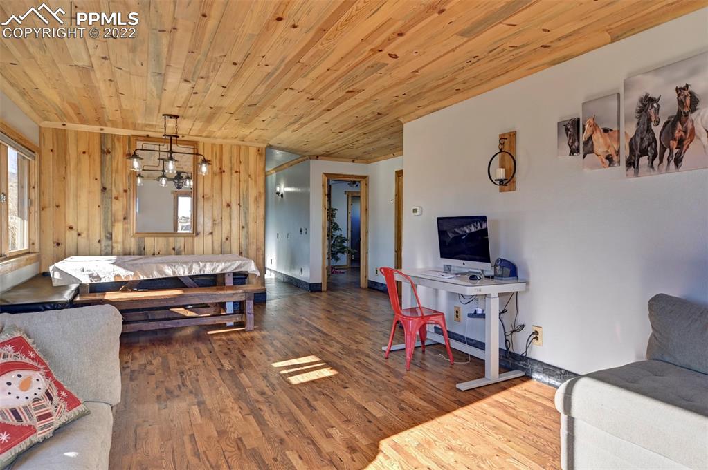 8225 3 R Road Beulah, CO 81023 - Photo 14 of 41 a living room with patio furniture and a flat screen tv