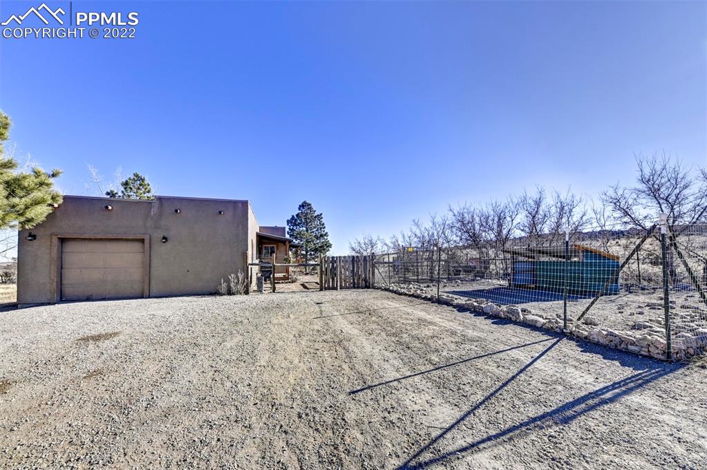 8225 3 R Road Beulah, CO 81023 - Photo 7 of 41 a backyard of a house with table and chairs
