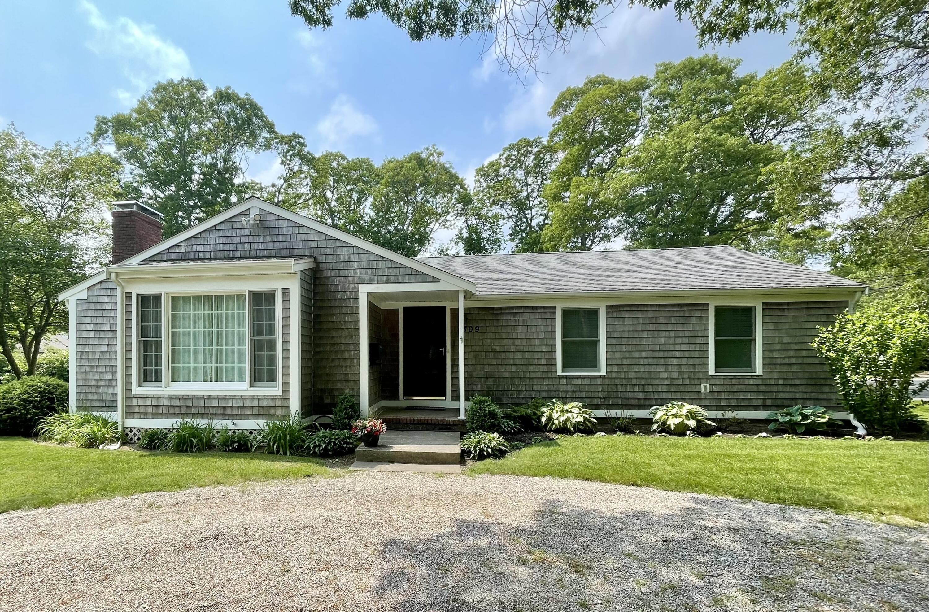 front view of a house with a yard