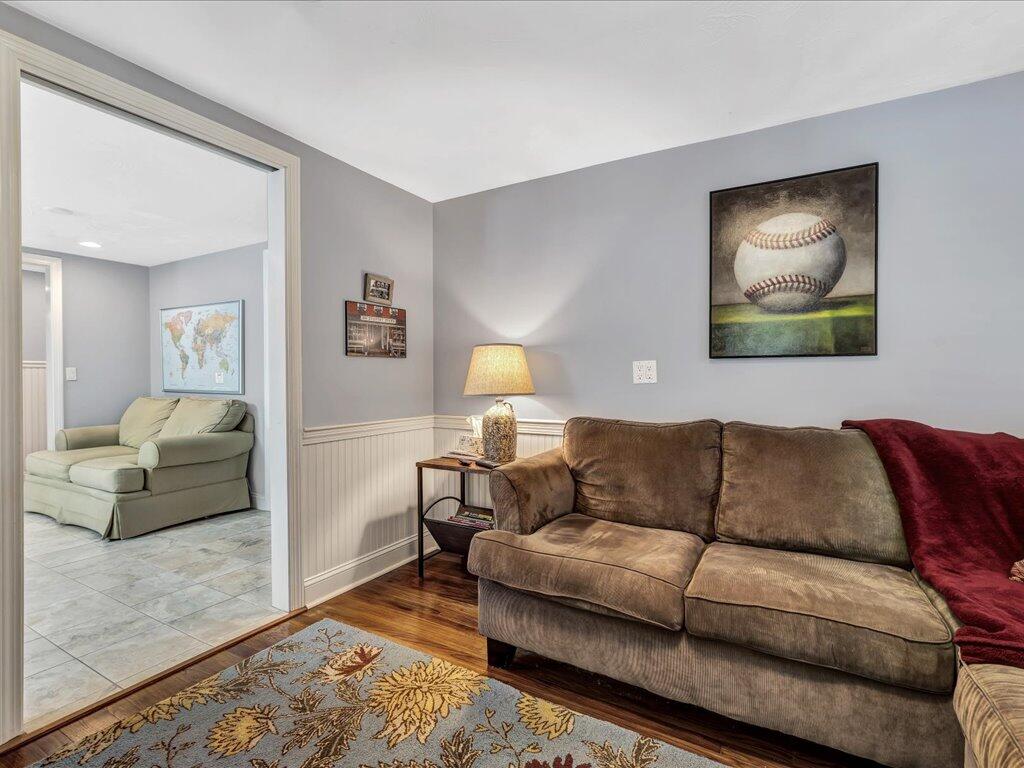 1309 Shootflying Hill Road Centerville, MA 02632 - Photo 19 of 52 a living room with furniture and a couch