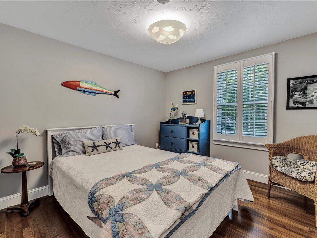 1309 Shootflying Hill Road Centerville, MA 02632 - Photo 24 of 52 a bedroom with double bed and a window