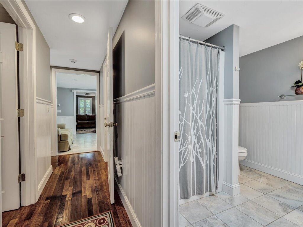 1309 Shootflying Hill Road Centerville, MA 02632 - Photo 29 of 52 a view of a hallway with a livingroom and a bathroom with sink