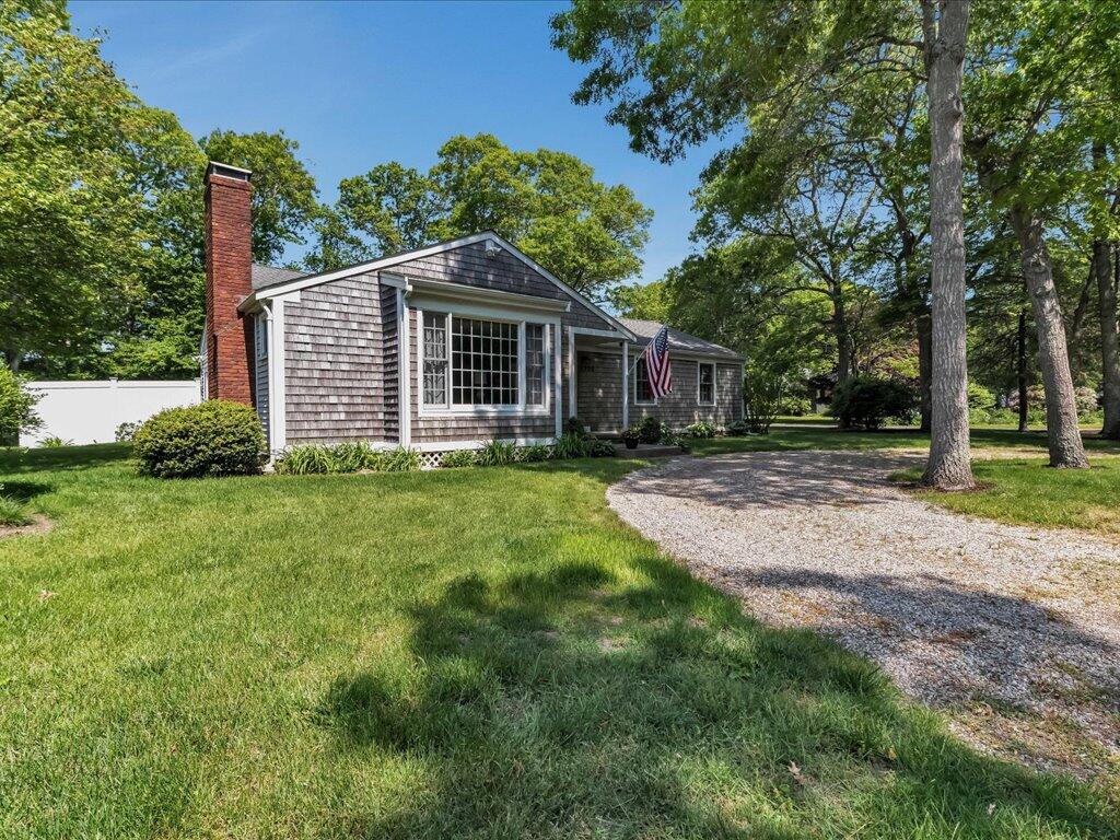 1309 Shootflying Hill Road Centerville, MA 02632 - Photo 3 of 52 a view of a house with yard and sitting area
