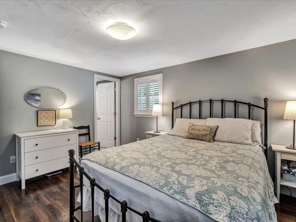 1309 Shootflying Hill Road Centerville, MA 02632 - Photo 33 of 52 a bedroom with a bed and a dresser
