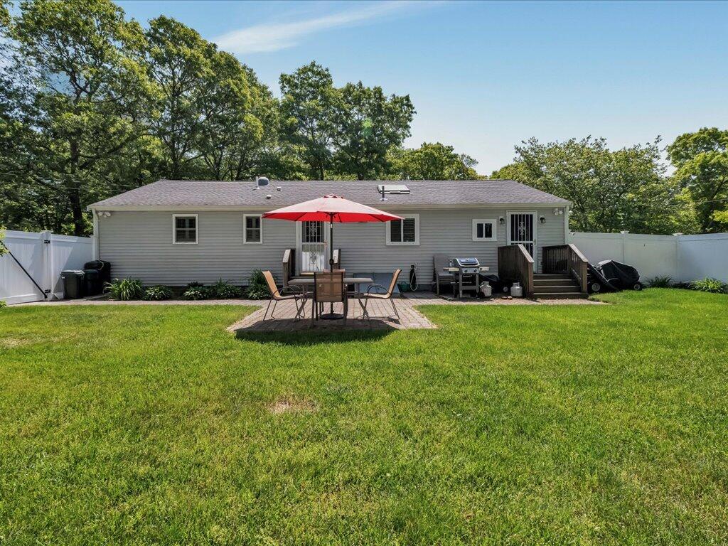 1309 Shootflying Hill Road Centerville, MA 02632 - Photo 38 of 52 a front view of house with yard and trees