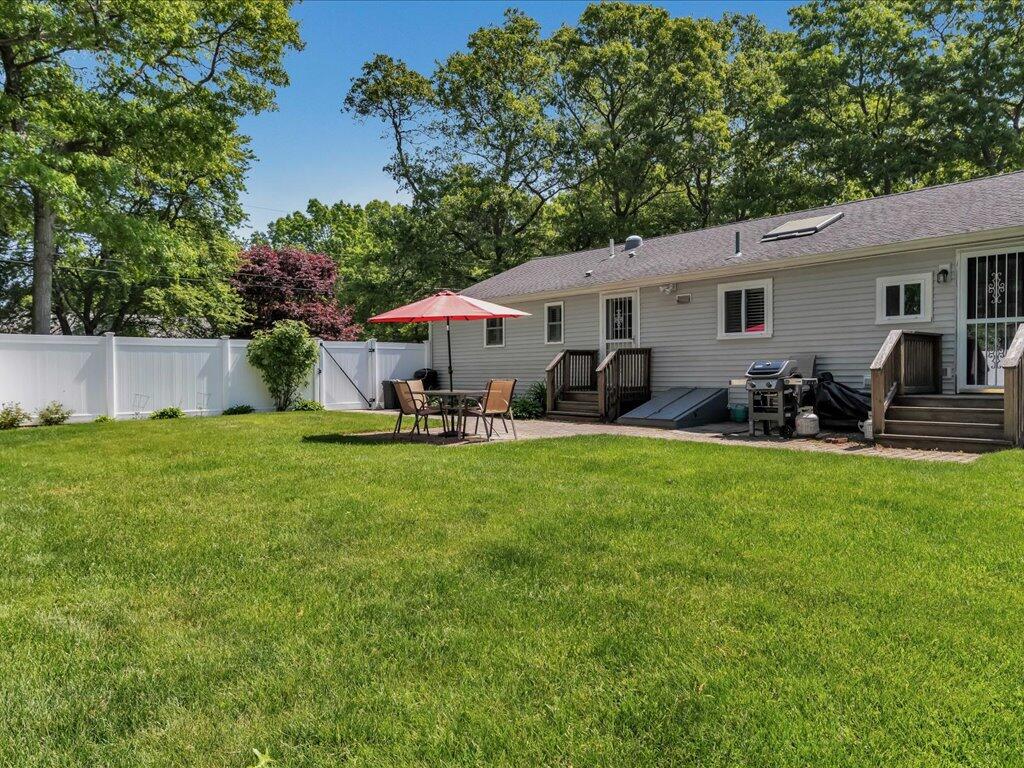 1309 Shootflying Hill Road Centerville, MA 02632 - Photo 39 of 52 a front view of house with yard and trees