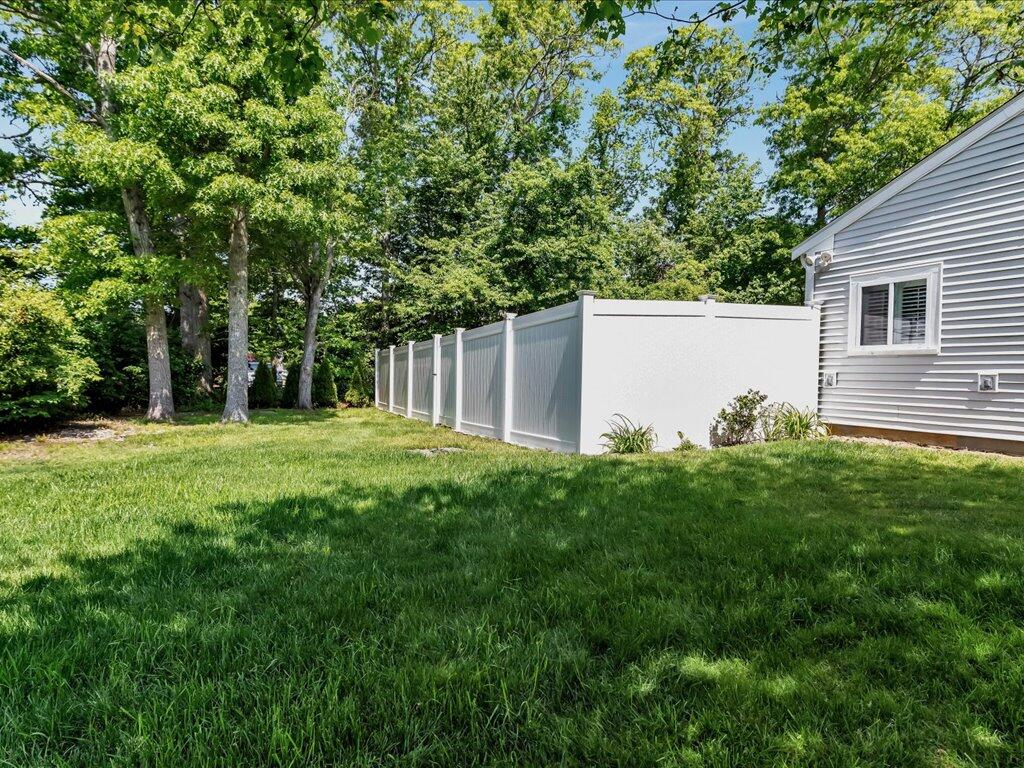 1309 Shootflying Hill Road Centerville, MA 02632 - Photo 43 of 52 a house view with a garden space