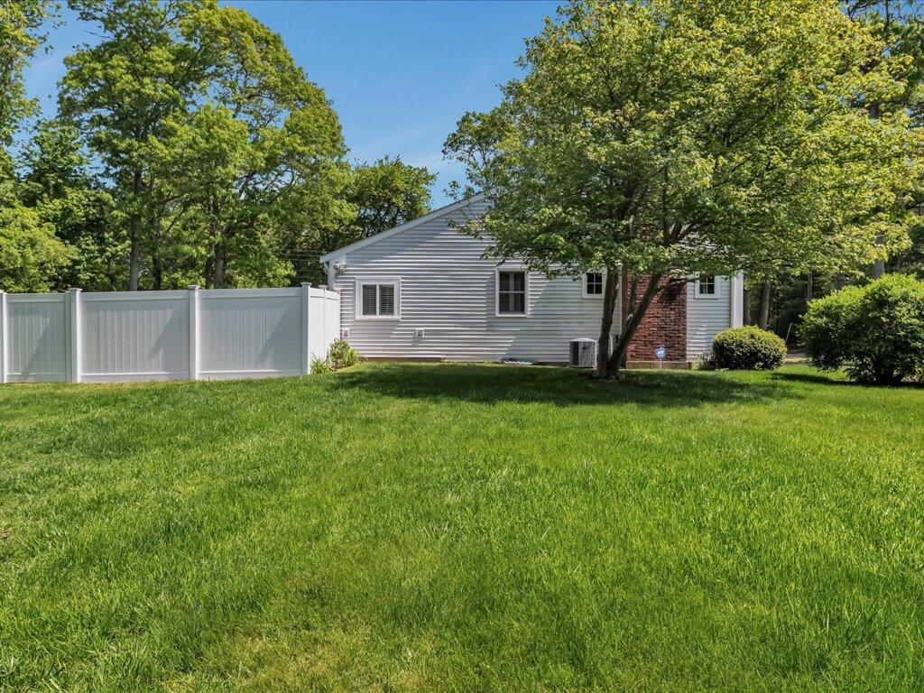 1309 Shootflying Hill Road Centerville, MA 02632 - Photo 46 of 52 a view of a house with backyard and garden
