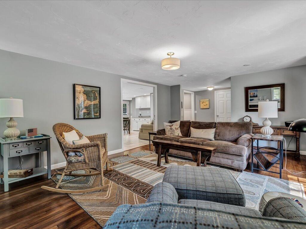 1309 Shootflying Hill Road Centerville, MA 02632 - Photo 8 of 52 a living room with furniture and wooden floor
