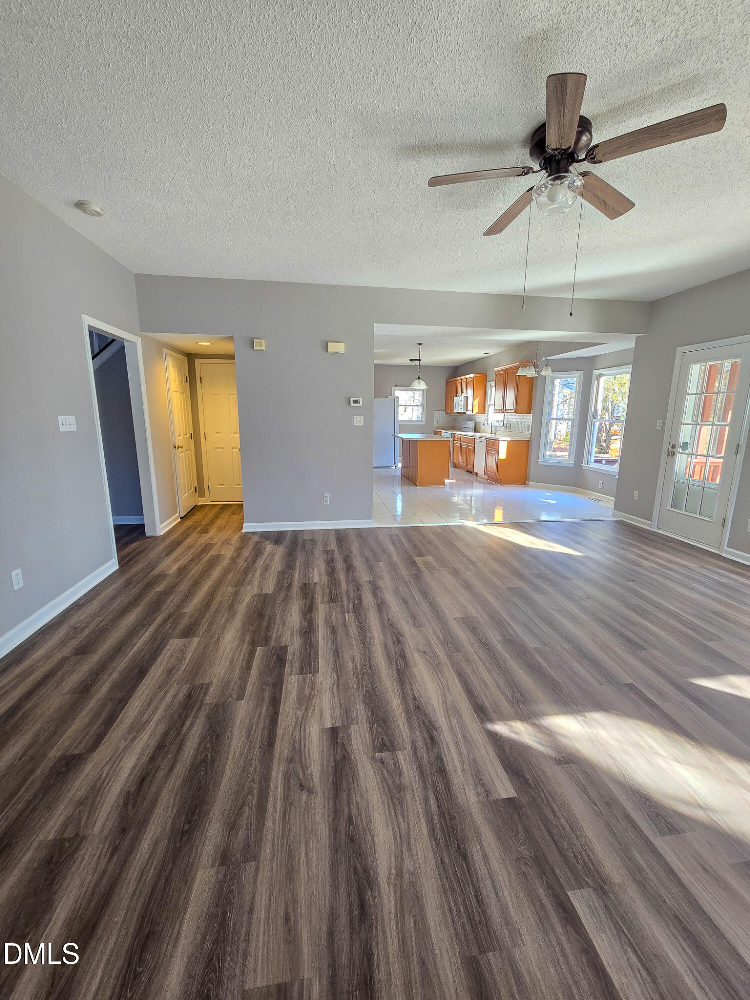 2205 Dungiven Court Garner, NC 27529 - Photo 12 of 66 a view of empty room with wooden floor and fan