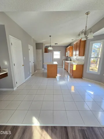 a kitchen with a refrigerator and washer