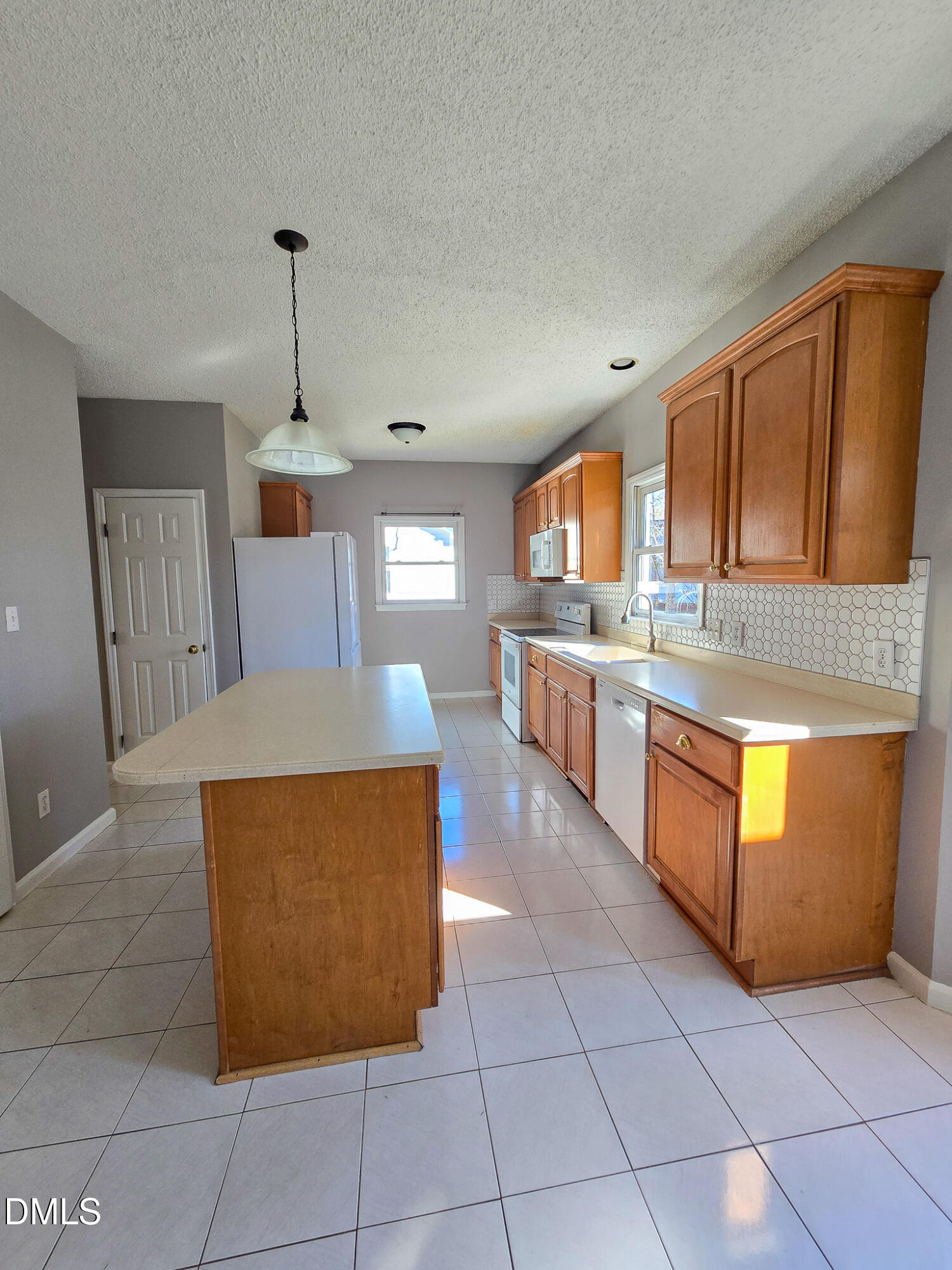 2205 Dungiven Court Garner, NC 27529 - Photo 18 of 66 a kitchen with stainless steel appliances granite countertop a stove a sink and a microwave