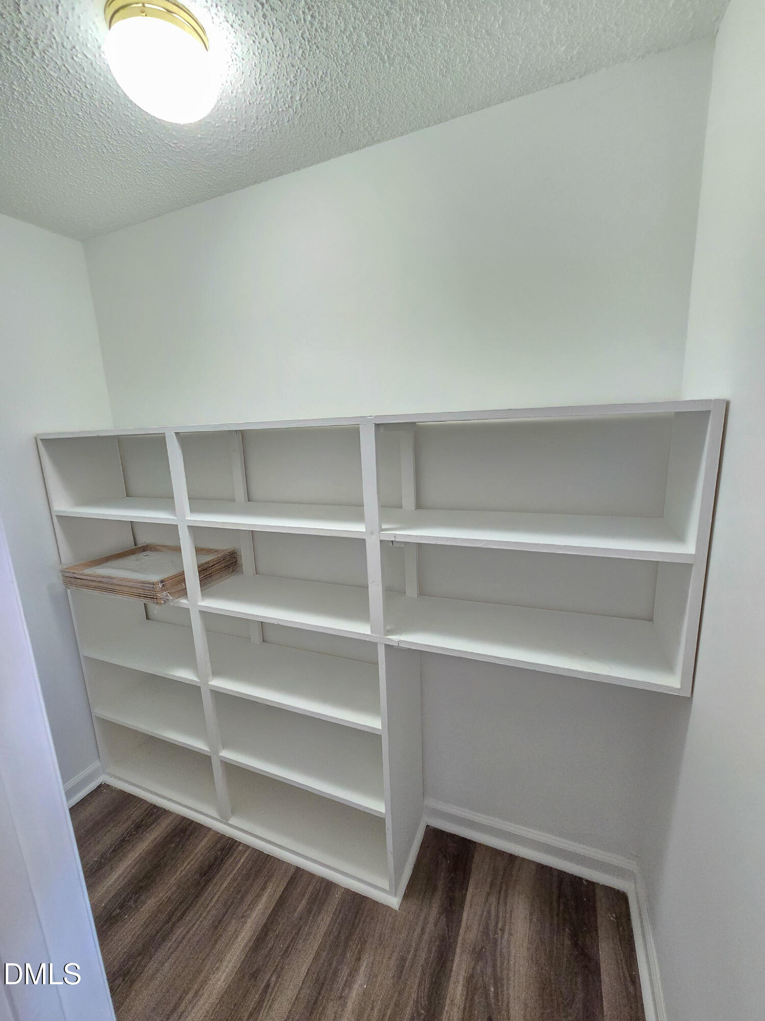 2205 Dungiven Court Garner, NC 27529 - Photo 23 of 66 a view of walk in closet with empty racks