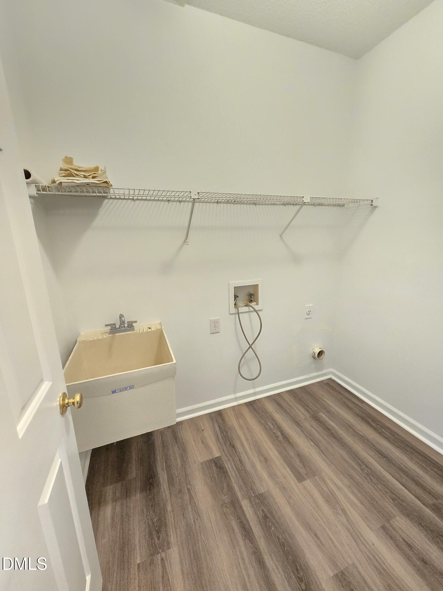 2205 Dungiven Court Garner, NC 27529 - Photo 24 of 66 a view of a room with racks on the wall