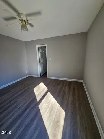 a view of a living room and wooden floor