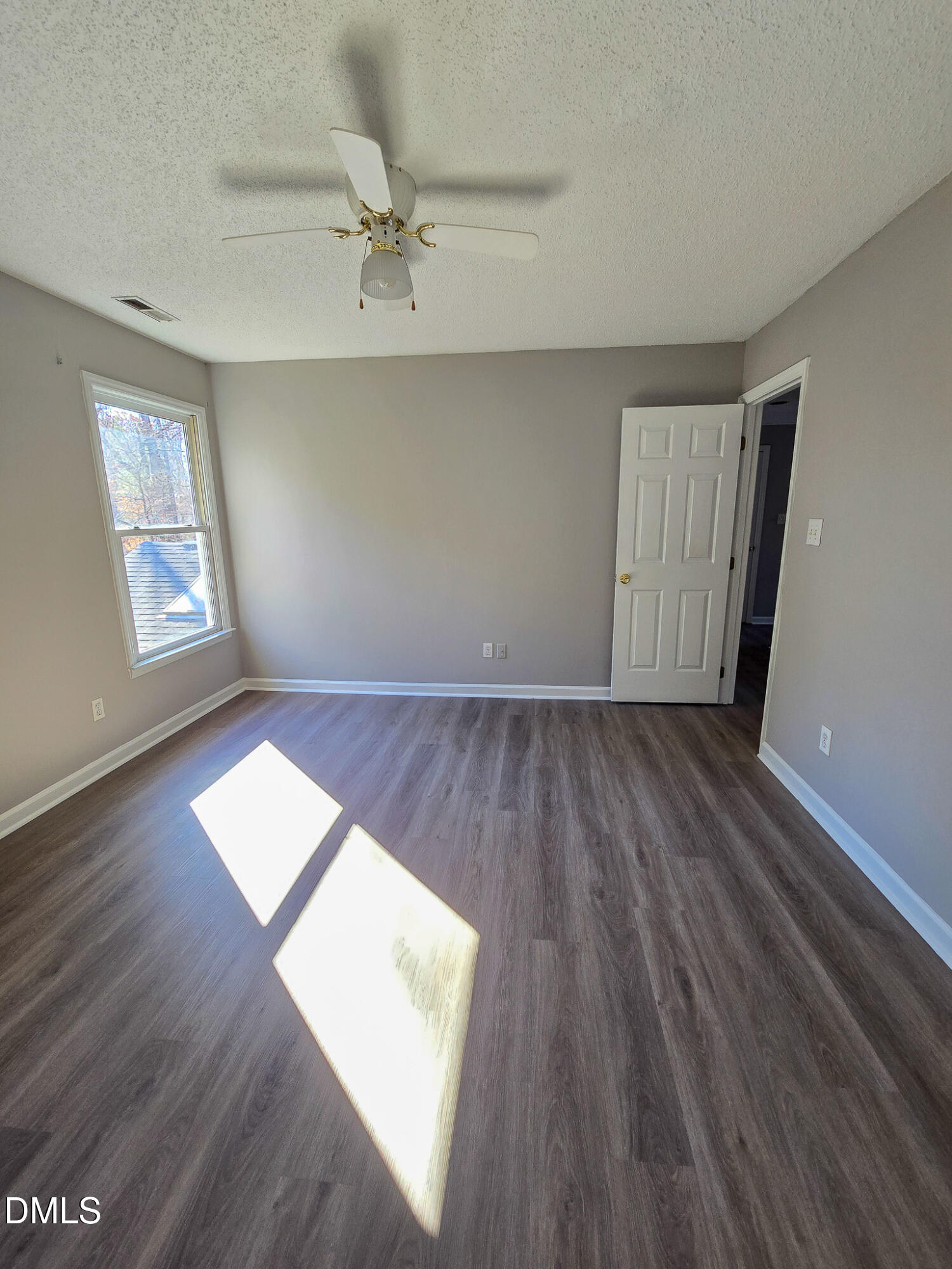 2205 Dungiven Court Garner, NC 27529 - Photo 48 of 66 wooden floor in an empty room with a window