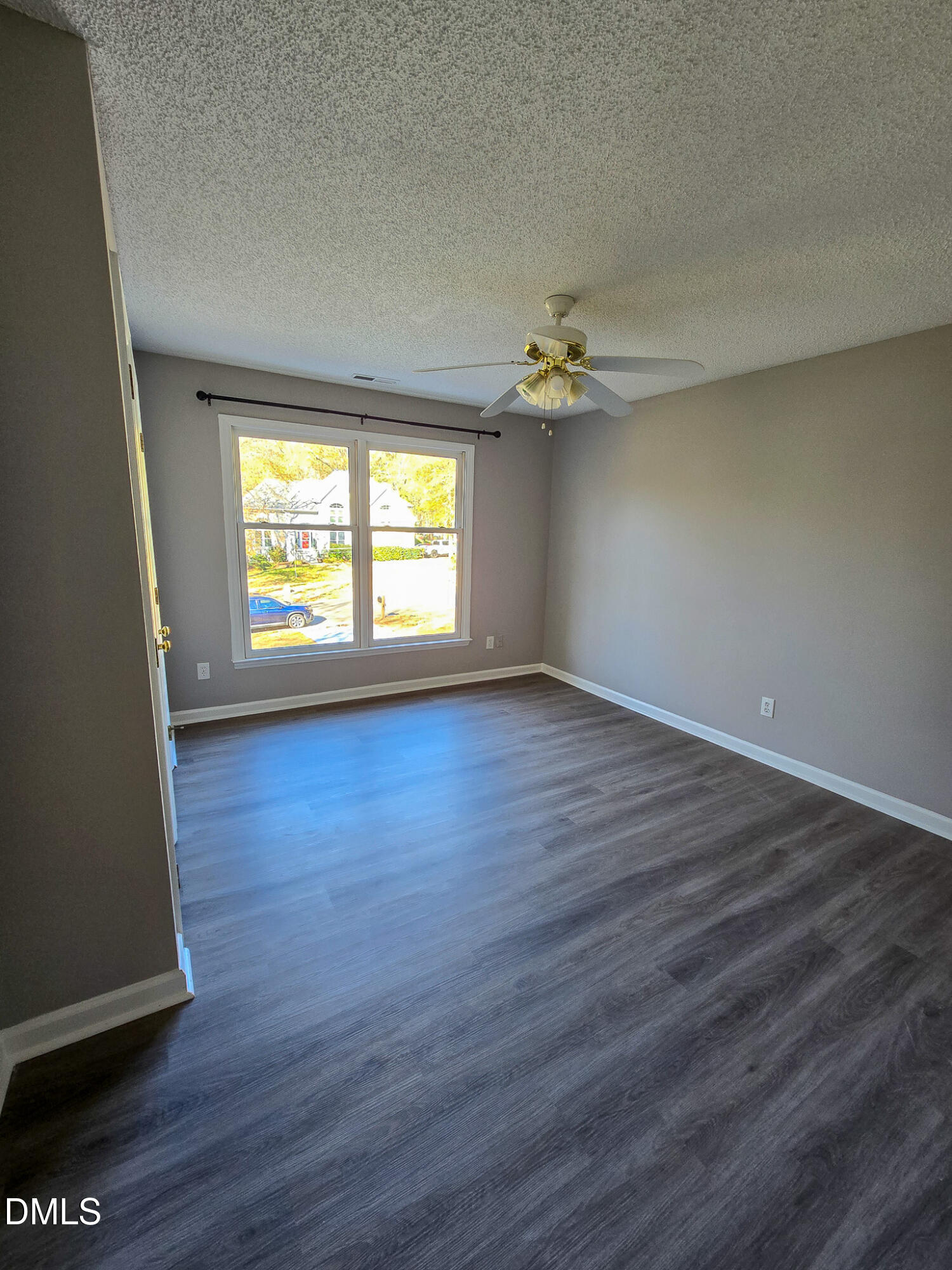 2205 Dungiven Court Garner, NC 27529 - Photo 50 of 66 an empty room with wooden floor and windows