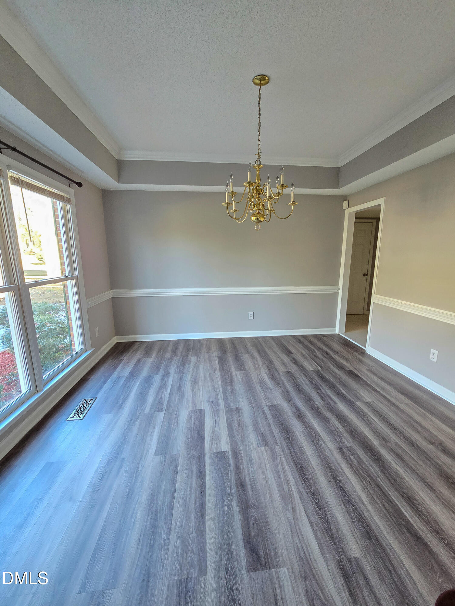2205 Dungiven Court Garner, NC 27529 - Photo 7 of 66 wooden floor in an empty room with a window
