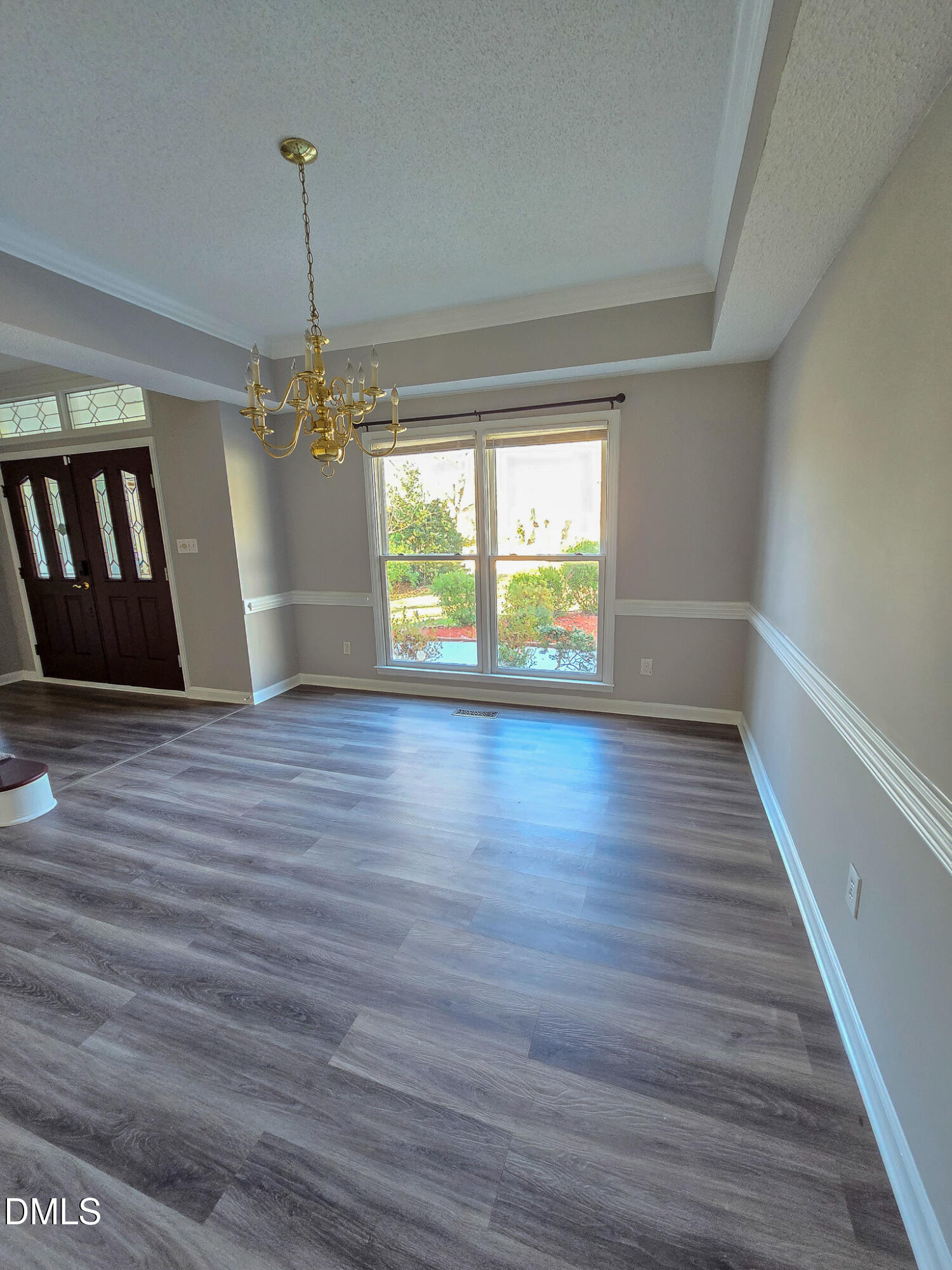 2205 Dungiven Court Garner, NC 27529 - Photo 8 of 66 a view of empty room with wooden floor and fan