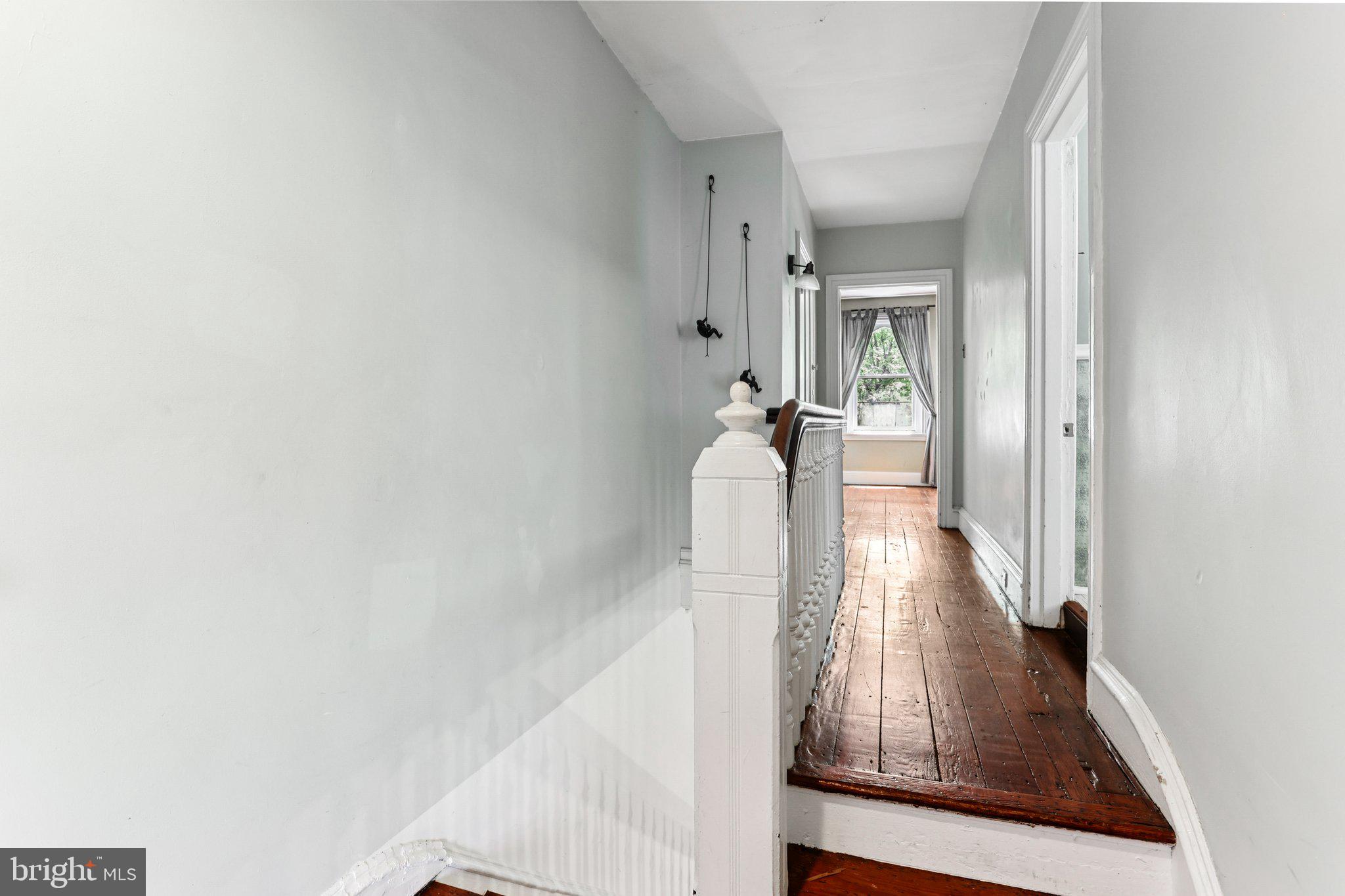 2335 Christian Street Philadelphia, PA 19146 - Photo 14 of 33 a view of a hallway with wooden floor and staircase