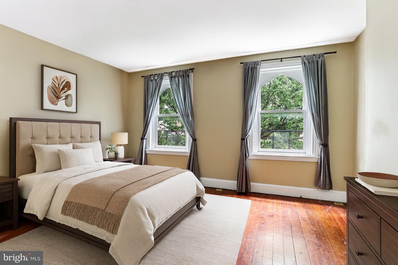 2335 Christian Street Philadelphia, PA 19146 - Photo 20 of 33 a bedroom with a large bed and a large window