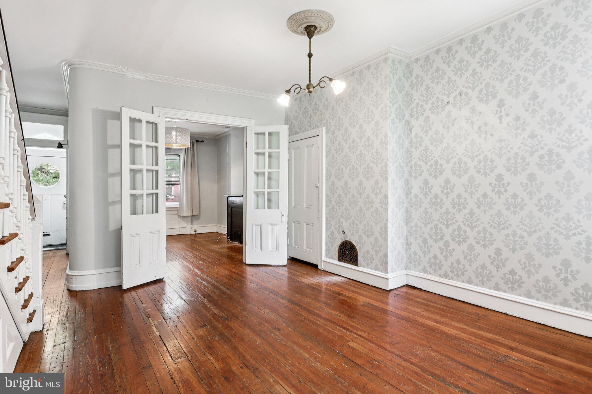2335 Christian Street Philadelphia, PA 19146 - Photo 7 of 33 a view of an empty room with wooden floor and a window