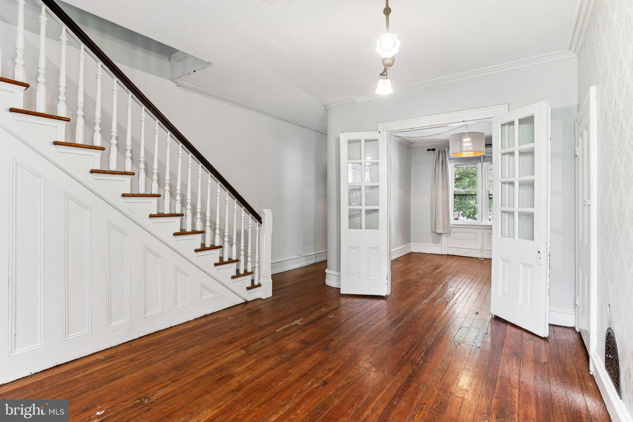 2335 Christian Street Philadelphia, PA 19146 - Photo 8 of 33 a view of staircase with wooden floor and white walls