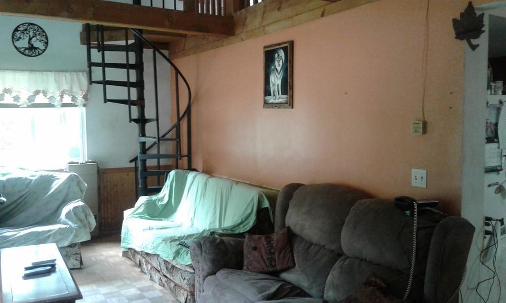 146 Colrain Stage Road Heath, MA 01346 - Photo 5 of 12 a living room with furniture and a gate