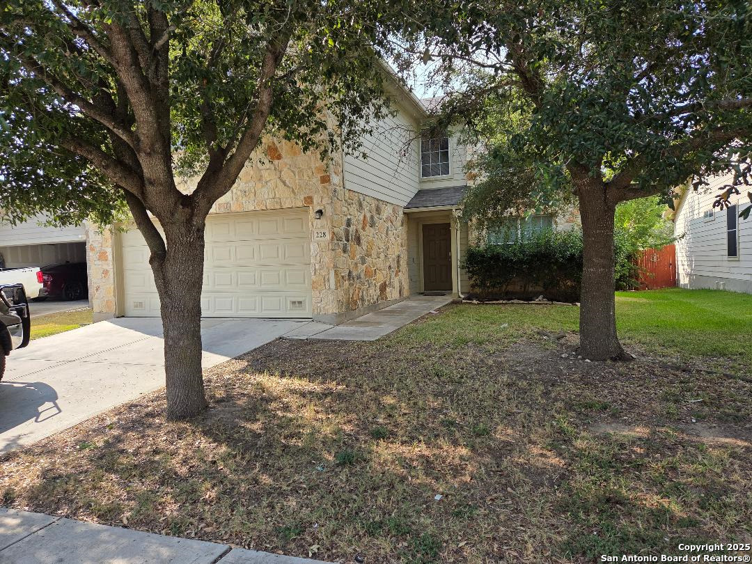 228 Anvil Place Cibolo, TX 78108 - Photo 1 of 21 a view of a yard with plants and trees