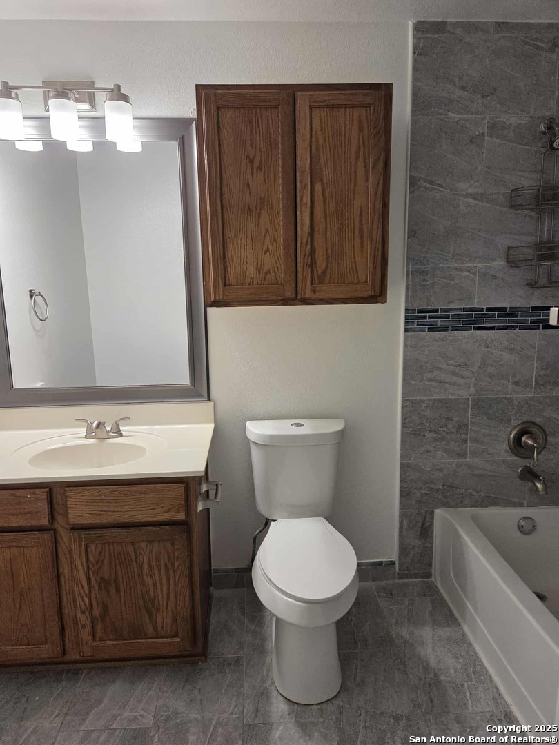 228 Anvil Place Cibolo, TX 78108 - Photo 21 of 21 a bathroom with a toilet a sink and bathtub