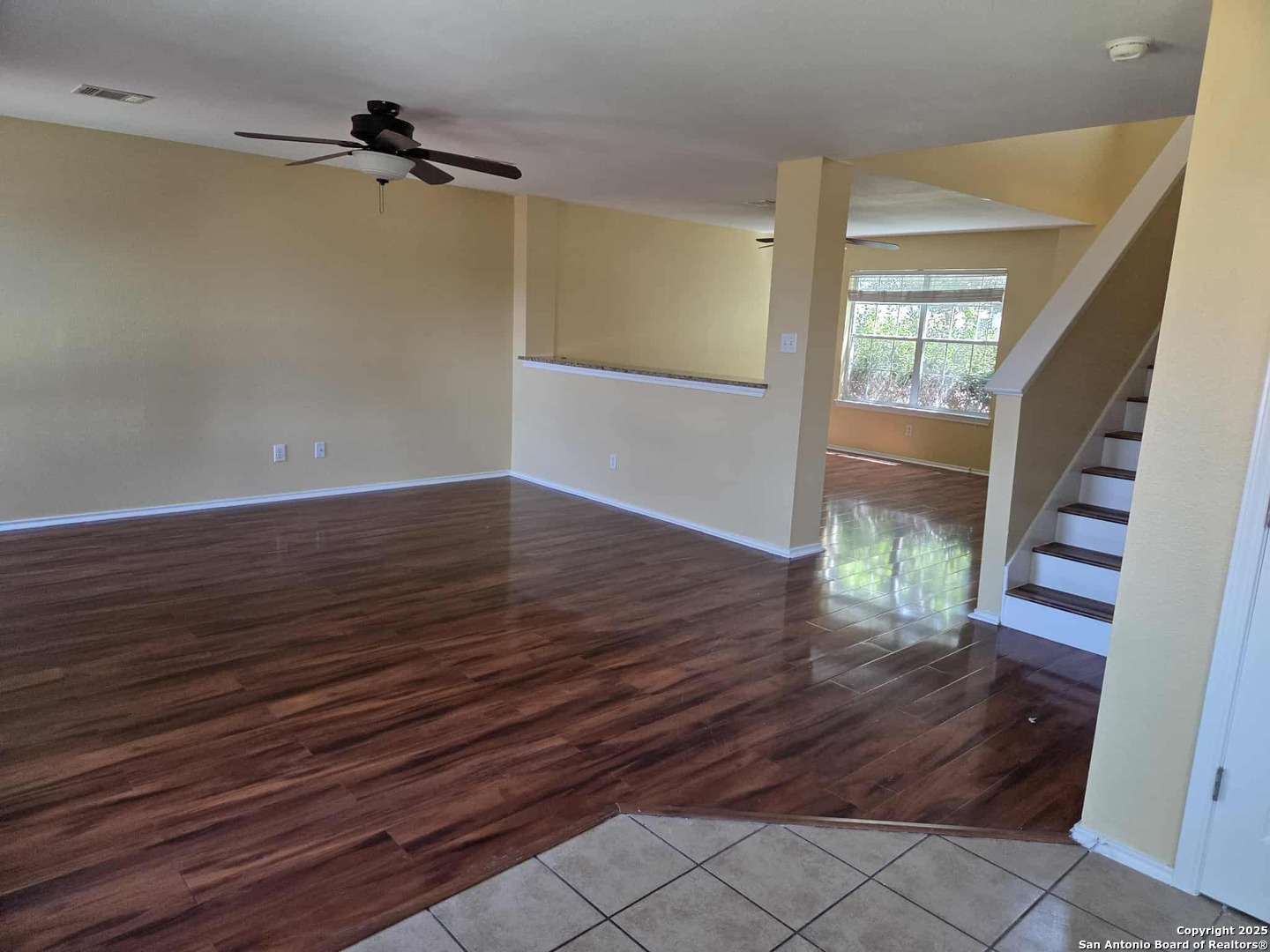 228 Anvil Place Cibolo, TX 78108 - Photo 5 of 21 wooden floor in an empty room with a window