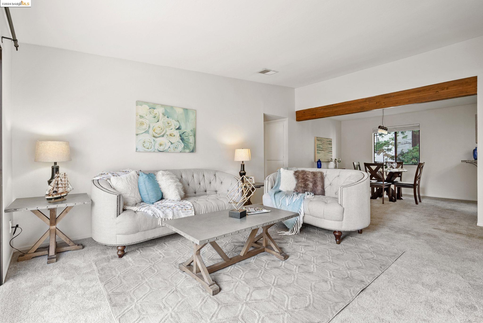 a living room with furniture and a table