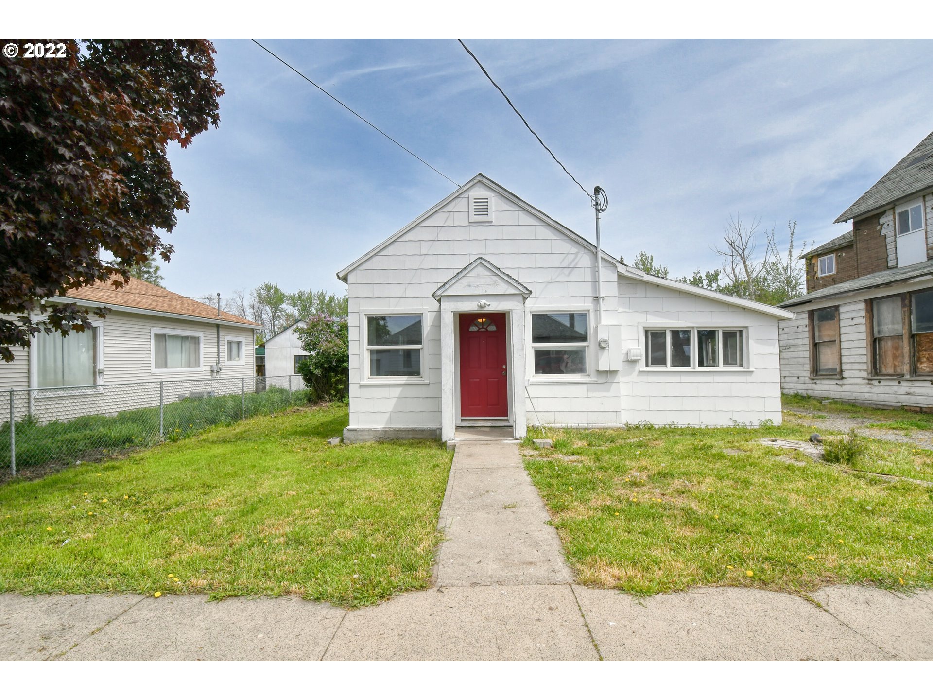 a front view of a house with a yard