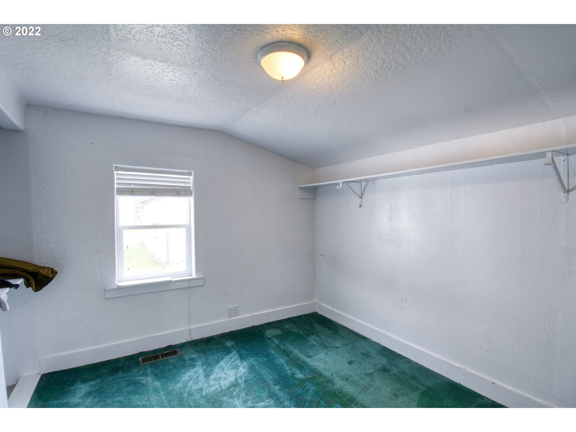 211 West Arch Street Union, OR 97883 - Photo 17 of 32 a view of an empty room with window and wooden floor