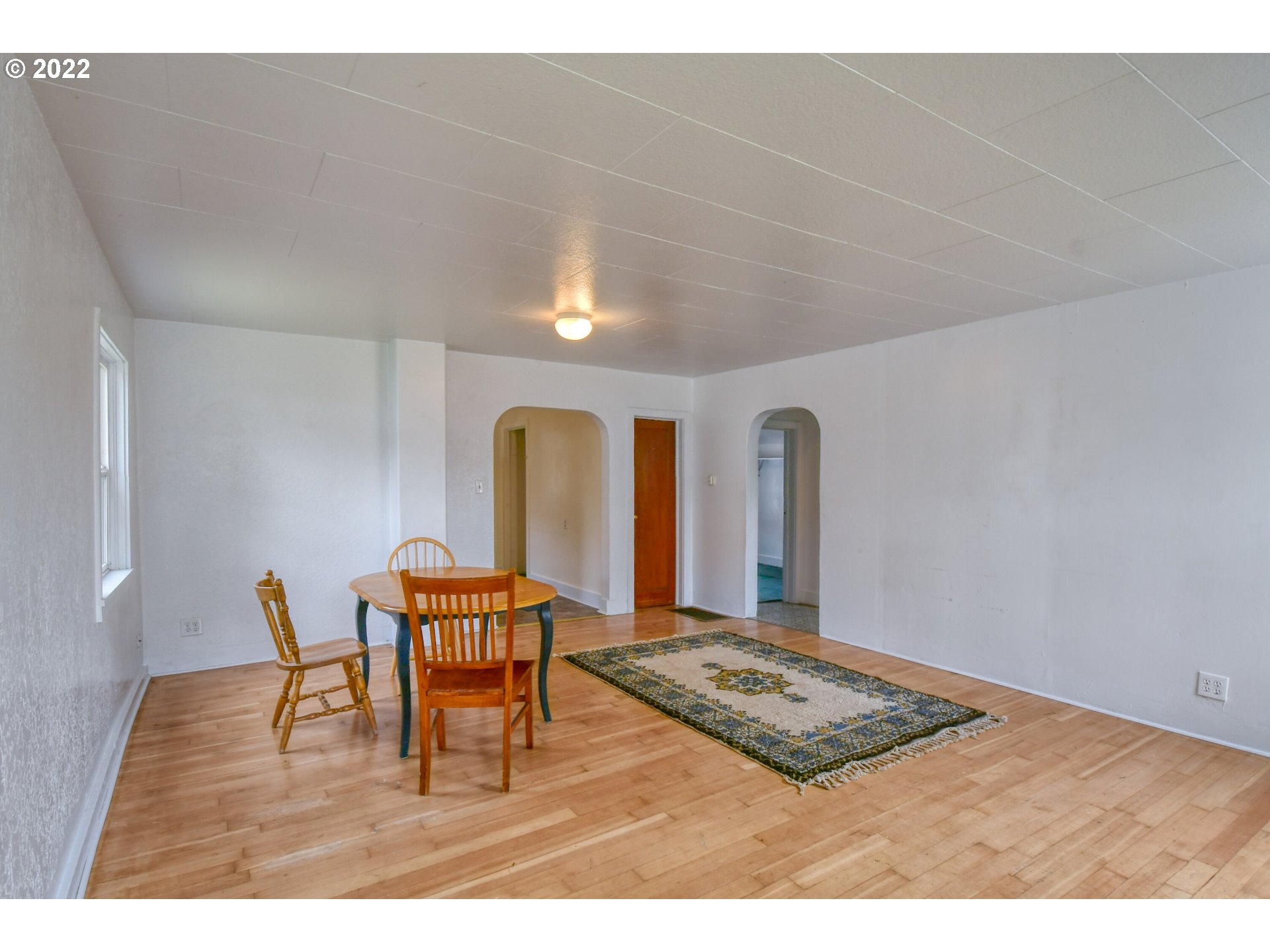 211 West Arch Street Union, OR 97883 - Photo 4 of 32 a view of a dining room with furniture and wooden floor