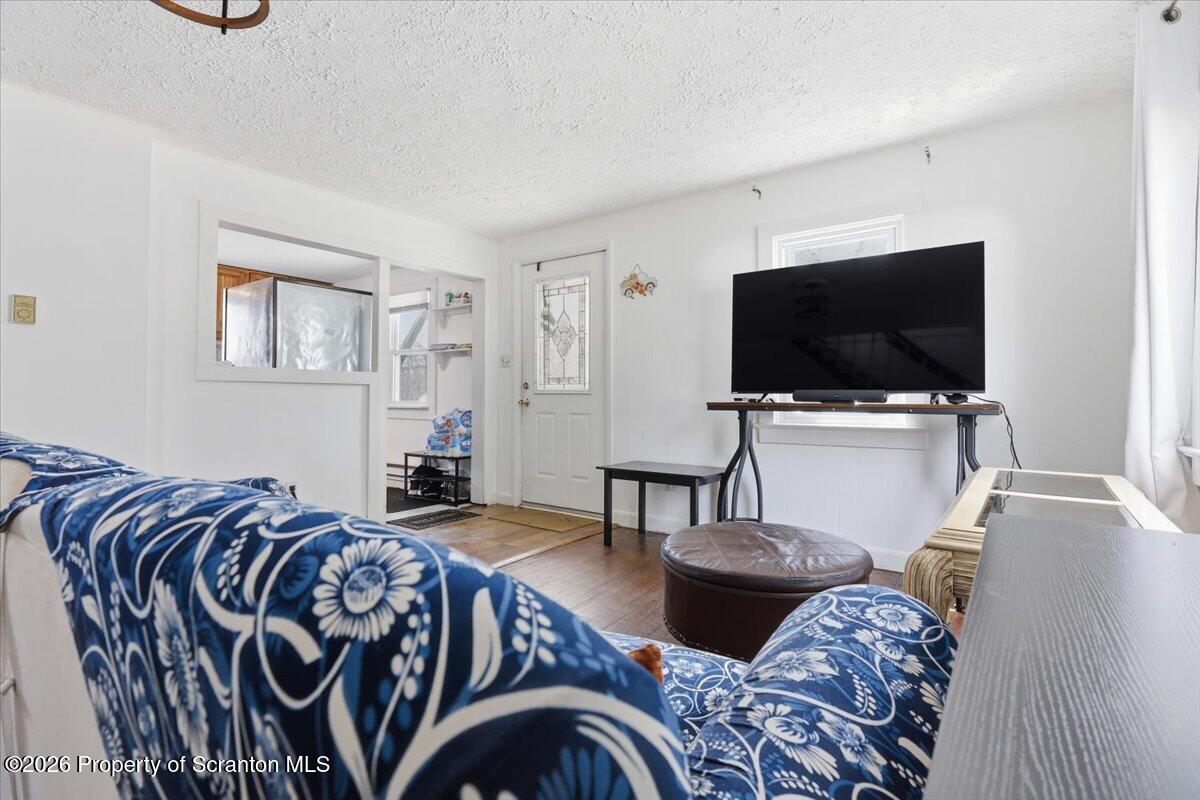 22 Quay Avenue Mount Pocono, PA 18344 - Photo 11 of 62 a living room with furniture and a flat screen tv
