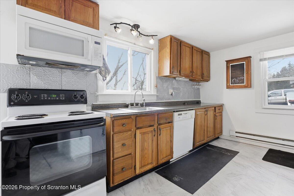 22 Quay Avenue Mount Pocono, PA 18344 - Photo 18 of 62 a kitchen with stainless steel appliances granite countertop a stove a sink and a microwave