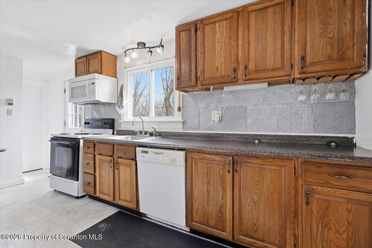 22 Quay Avenue Mount Pocono, PA 18344 - Photo 21 of 62 a kitchen with stainless steel appliances granite countertop a sink stove and cabinets