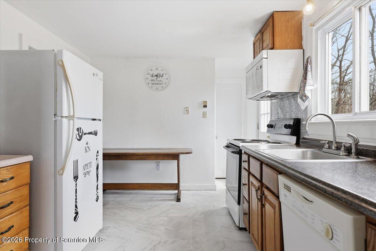 22 Quay Avenue Mount Pocono, PA 18344 - Photo 23 of 62 a kitchen with stainless steel appliances a sink a refrigerator and a stove