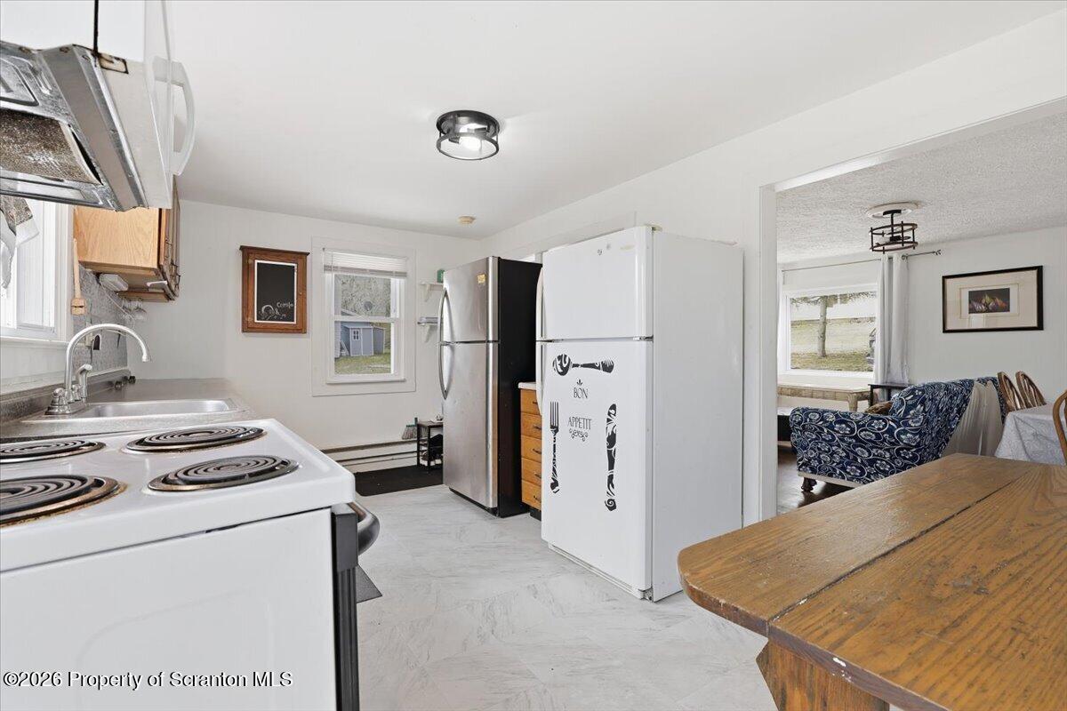 22 Quay Avenue Mount Pocono, PA 18344 - Photo 24 of 62 a living room with stainless steel appliances kitchen island a stove and a refrigerator