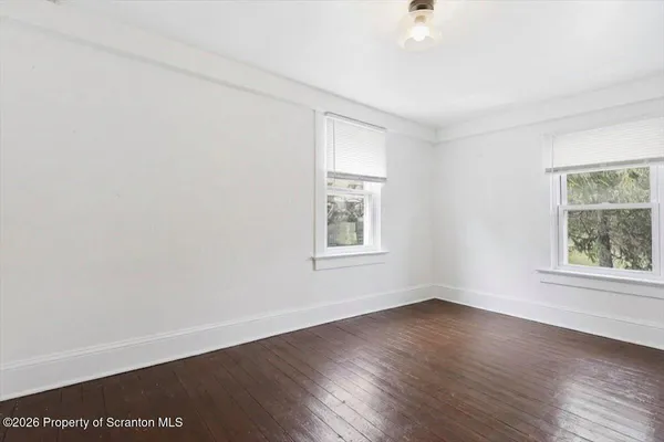 a bedroom with a bed and a chair