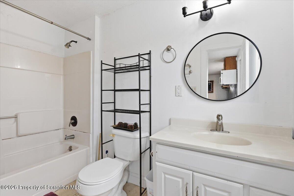 22 Quay Avenue Mount Pocono, PA 18344 - Photo 37 of 62 a bathroom with a sink a mirror a toilet and a tub