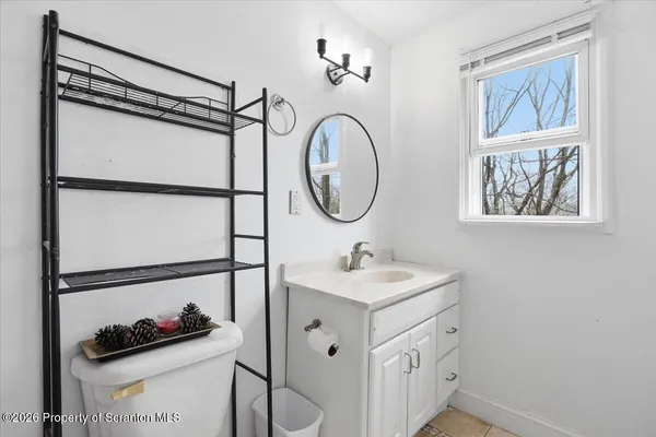 a bathroom with a shower and a sink